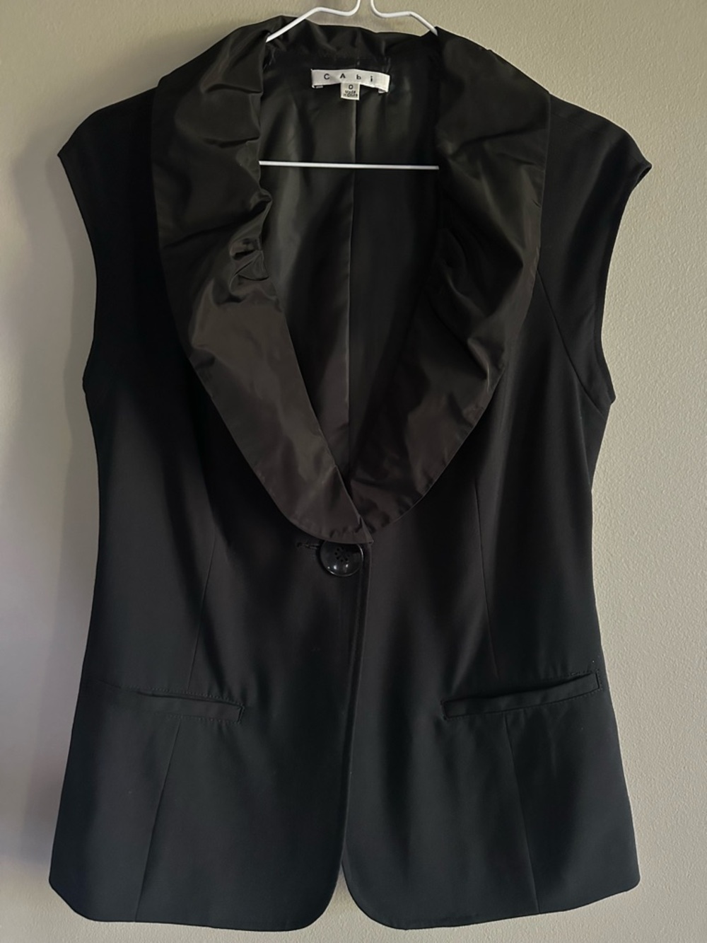 Cabi; size 0; sleeveless vest. Brand new. Never worn.